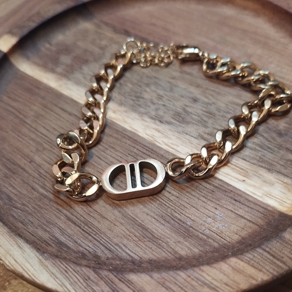 Gold Tone Link Bracelet with Oval Logo Charm